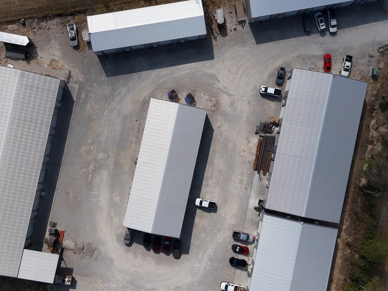 Shop buildings and the gravel yard from straight above at United Flex Anna